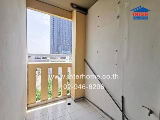 Compact balcony with urban view in high-rise building