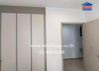 Spacious bedroom with large built-in wardrobes