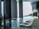 Modern infinity pool with skyline views at luxury apartment complex