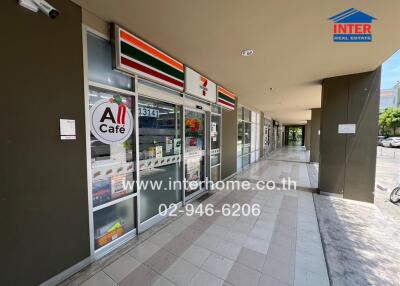 Exterior view of a commercial storefront with convenience store