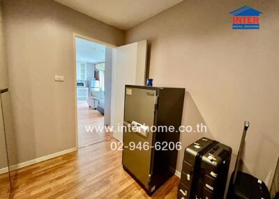 Well-lit entrance hall with laminate flooring, leading to an inviting living room