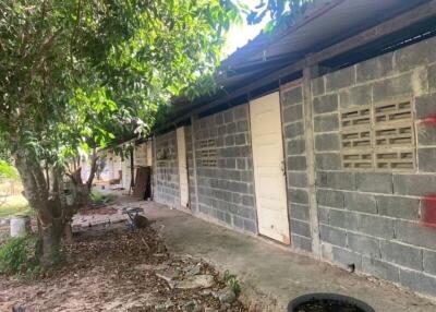 Unfinished rural building exterior with cinder block walls