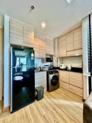 Modern kitchen with integrated appliances and wooden cabinetry