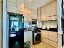 Modern kitchen with integrated appliances and wooden cabinetry