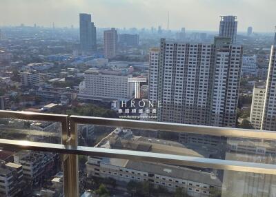 City view from high-rise balcony showing urban landscape