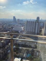 City view from high-rise balcony showing urban landscape