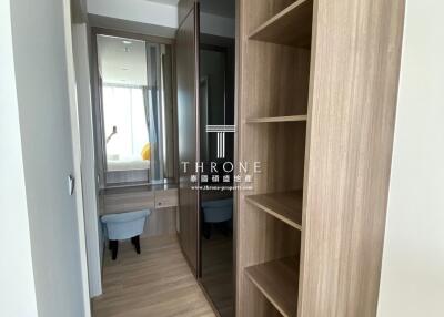 Elegant bedroom with attached bathroom and stylish built-in wardrobe
