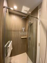 Modern bathroom interior with glass shower doors