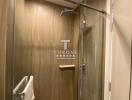 Modern bathroom interior with glass shower doors