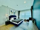 Elegant modern bedroom with blue accents and artistic decor