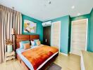 Bright and cozy bedroom with teal walls and wooden furnishings