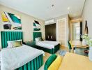 Modern twin bedroom with vibrant decor and ample natural light