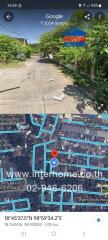 Outdoor street view showing road and surrounding environment from a real estate mapping service