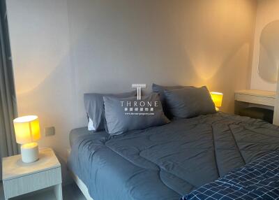 Modern bedroom with elegant decor and soft lighting