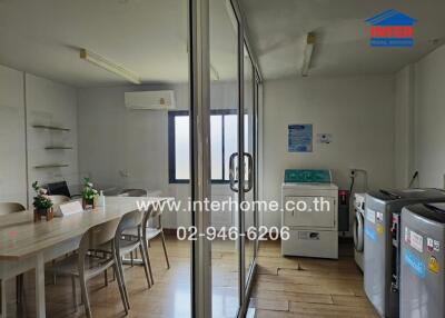 Spacious multi-functional room featuring dining area and laundry facilities