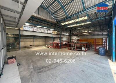 Spacious industrial warehouse interior with metal constructions