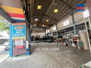 Spacious industrial workshop interior with machinery and tools