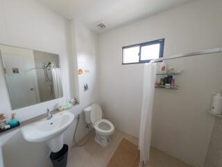 Spacious and well-equipped bathroom with modern amenities and natural light