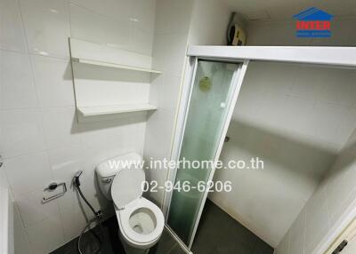Compact modern bathroom with glass shower