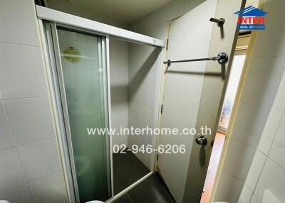 Compact modern bathroom with shower enclosure