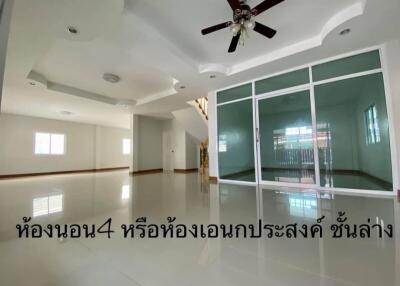 Spacious modern living room with reflective tile flooring and large glass partition