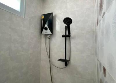 Modern bathroom interior with wall-mounted shower system