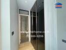 Modern hallway with glass door leading to shower and mirrored wardrobe