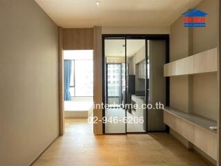 Modern kitchen with adjacent living area in a bright apartment