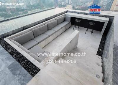 Luxurious balcony with city view featuring modern outdoor seating
