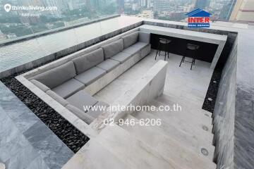 Luxurious balcony with city view featuring modern outdoor seating