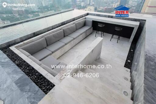 Luxurious balcony with city view featuring modern outdoor seating