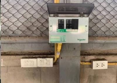 Electrical breaker and outlets on a concrete wall
