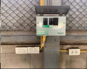 Electrical breaker and outlets on a concrete wall