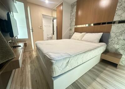 Modern bedroom with elegant wood accents and well-designed layout