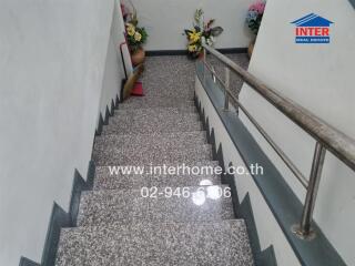 Marble staircase with railings and decorative flowers