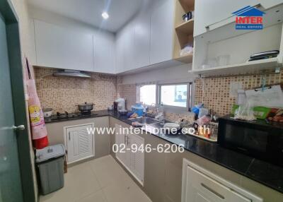 Spacious modern kitchen with ample storage and countertops
