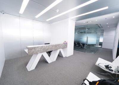 Modern office space with minimalist white design and marble accents