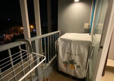 Cozy balcony at night with lighting and cover protected seating