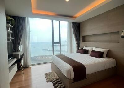 Modern bedroom with ocean view and elegant interior design