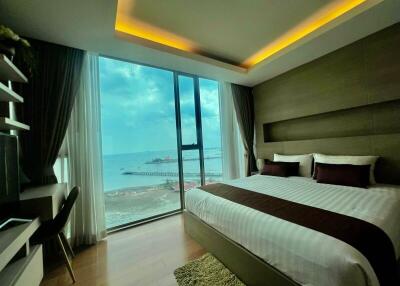 Luxurious beachfront bedroom with panoramic sea view