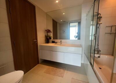 Modern bathroom with white vanity and glass shower
