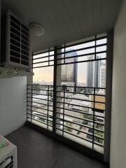 Urban view from a high-rise apartment balcony with cityscape