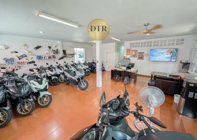 Spacious showroom interior with multiple scooters on display
