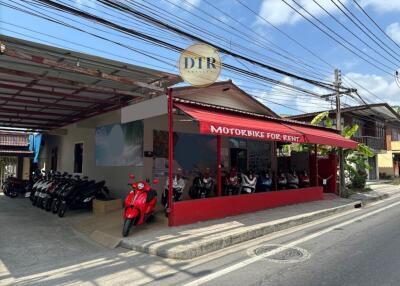 Exterior view of a motorbike rental shop