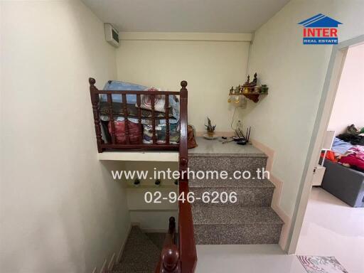 Interior view of a staircase in a home with storage items