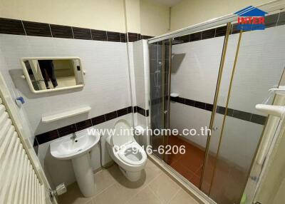 Modern bathroom with shower enclosure and white fixtures