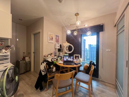 Spacious and well-lit living room with modern furnishings and balcony access