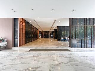 Spacious and modern lobby interior with marble flooring and contemporary design