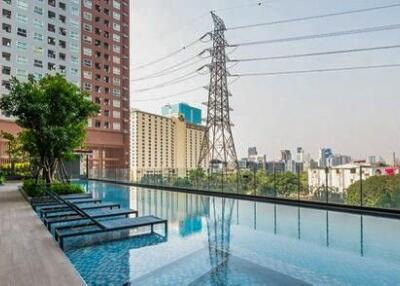 Luxurious rooftop swimming pool with city skyline view