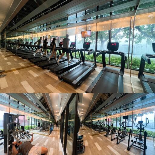 Modern gym facility in residential building with expansive glass walls and various workout equipment